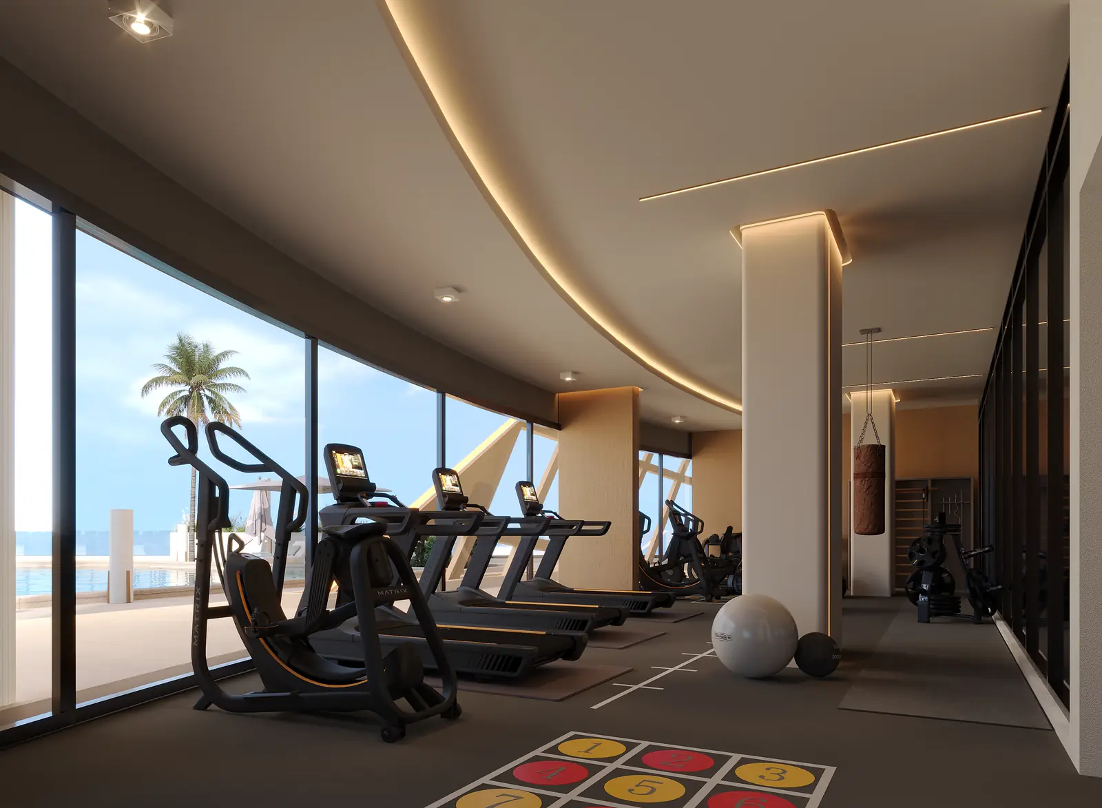 Residents' gym with treadmills facing floor-to-ceiling curved windows